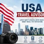 Travelers arriving at a major USA airport with luggage and digital travel advisory information screen in background